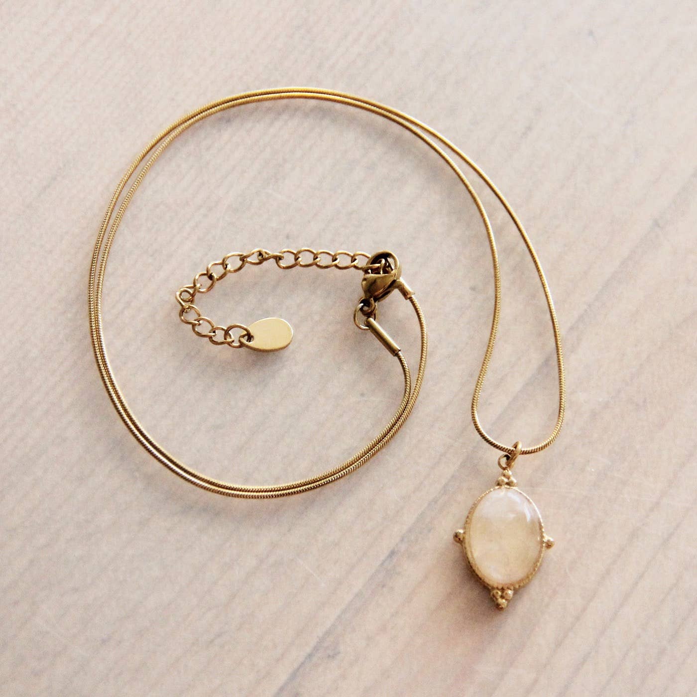 Stainless steel fine snake chain with oval pink stone