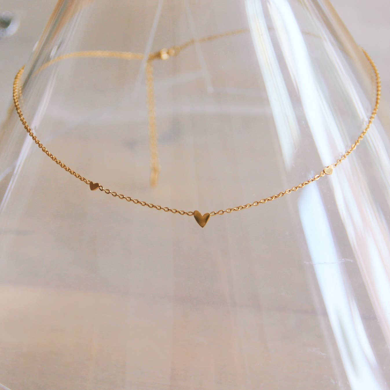 Stainless steel fine necklace with 3 mini hearts - gold